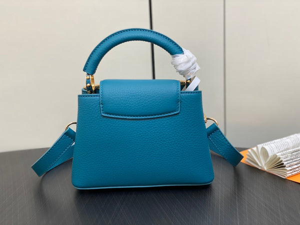 CAPUCINES MINI 21 BLUE TAURILLON GOLD HARDWARE