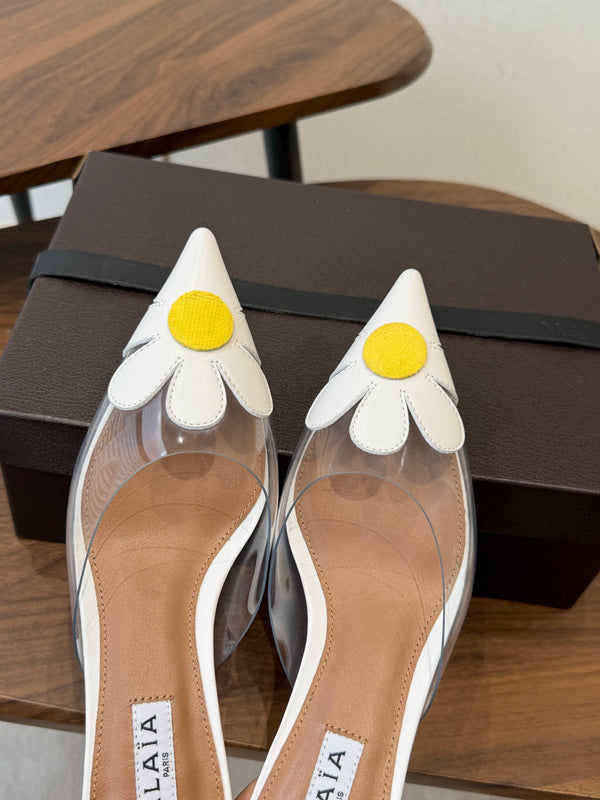 Alaia Daisy Mules 55mm Cowhide Clear PVC 889945