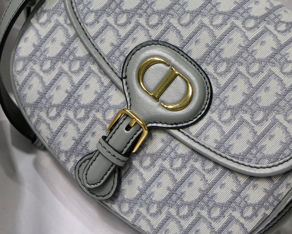 MEDIUM CD BOBBY 22CM GREY OBLIQUE CANVAS GOLD HARDWARE