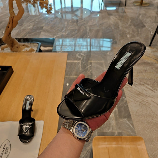 Prada 26S Open-Toe Mules 100mm in Black Patent Calfskin with Logo