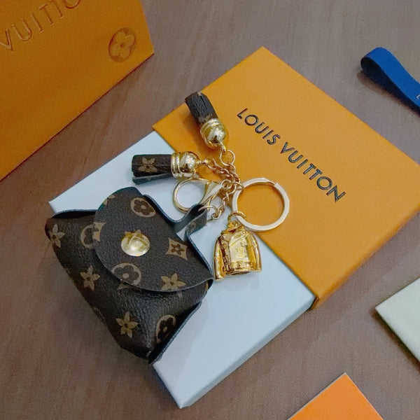 LV Brown and Beige Bag Charm With Gold Cup