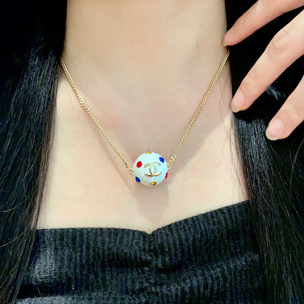 CC 26s Double C Logo White Enamel Crystal Ball Pendant Necklace In Gold Metal 629889