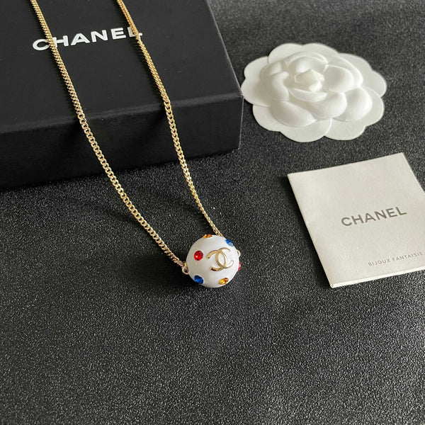CC 26s Double C Logo White Enamel Crystal Ball Pendant Necklace In Gold Metal 629889