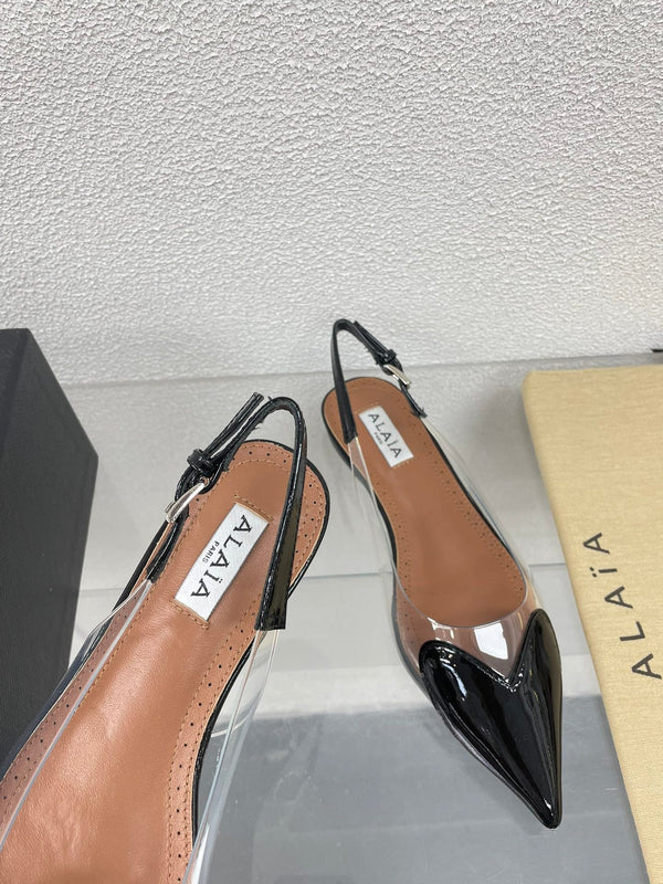 ALAIA LE COEUR FLAT SLINGBACKS IN BLACK PATENT LAMBSKIN