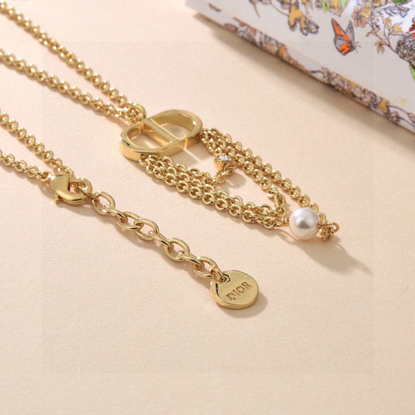 CD 26S Pearl Chain Drop Logo Necklace In Gold Tone Metal With White Resin Pearl & Crystal 631060