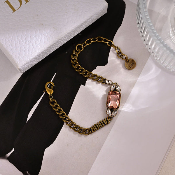 CD 26S Dior Logo Pink Crystal Chain Bracelet In Aged Gold Metal 633120