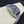 SANTOS DE CARTIE LARGE STEEL CASE BLACK BEZEL WHITE DIAL