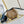 NOE PURSE 11.5 NANO CHARM BROWN MONOGRAM REVERSE CANVAS