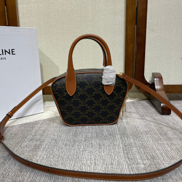 TOP HANDLE BAG 20 IN BLACK TRIOMPHE CANVAS AND BROWN CALFSKIN