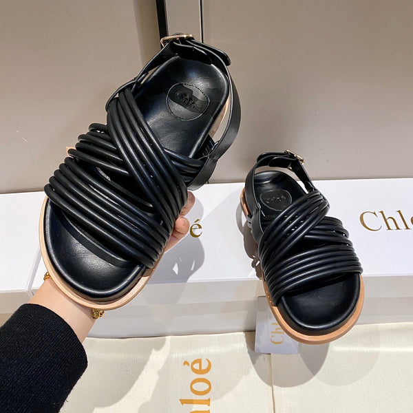 CHLOÉ CROSS STRAP SANDAL IN BLACK RUBBER WITH GOLD HARDWARE