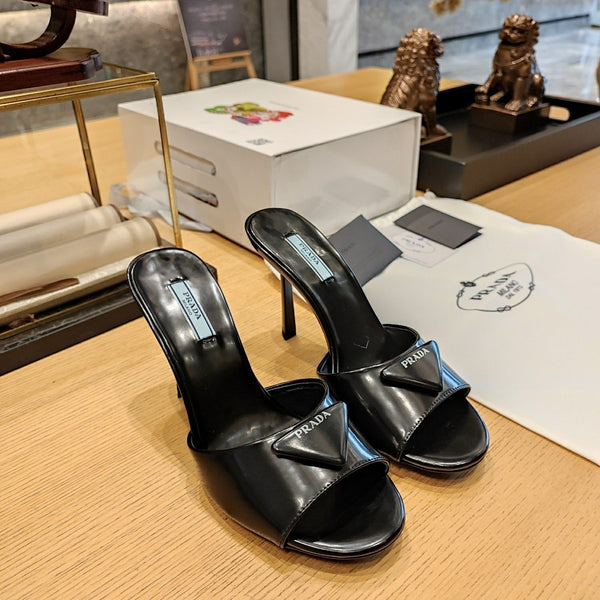 Prada 26S Open-Toe Mules 100mm in Black Patent Calfskin with Logo