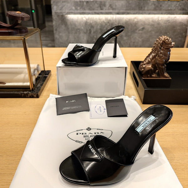 Prada 26S Open-Toe Mules 100mm in Black Patent Calfskin with Logo