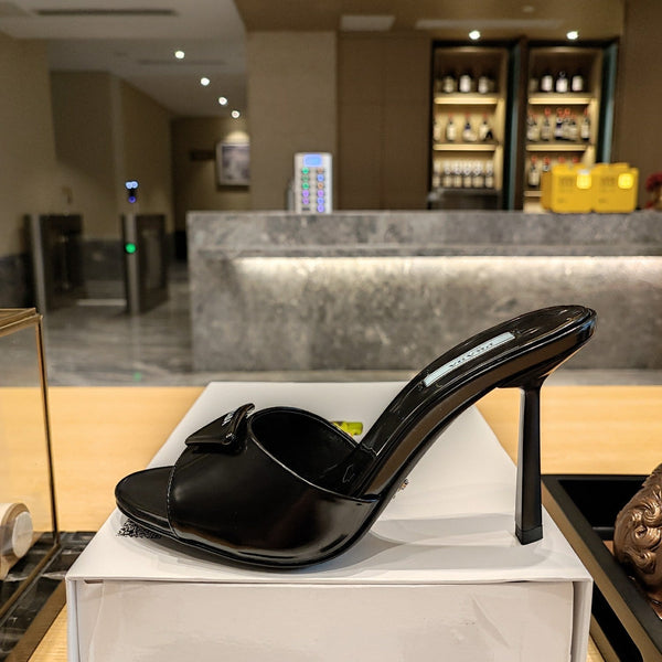 Prada 26S Open-Toe Mules 100mm in Black Patent Calfskin with Logo