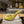 Prada 26S Open-Toe Mules 100mm in Lime Yellow Patent Calfskin with Logo