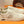 PRA TRAINER IN BEIGE CREAM CALFSKIN AND TAN EMBROIDERED FABRIC