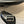 PETAL BELT FLAT SANDAL IN BLACK CALFSKIN