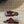 PETAL BELT FLAT SANDAL IN SANGRIA RED CALFSKIN