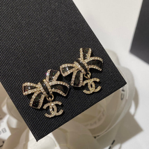 CC Crystals Black Enamel Bow Gold Earrings