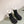 ANKLE BOOTS IN BLACK EMBOSSED CALFSKIN AND WHITE SHEARLING