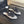 BIG BOW FLAT MULE SANDALS IN WHITE SILK WITH GLITTER SEQUINS