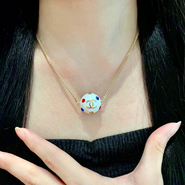 CC 26s Double C Logo White Enamel Crystal Ball Pendant Necklace In Gold Metal 629889