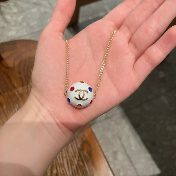 CC 26s Double C Logo White Enamel Crystal Ball Pendant Necklace In Gold Metal 629889