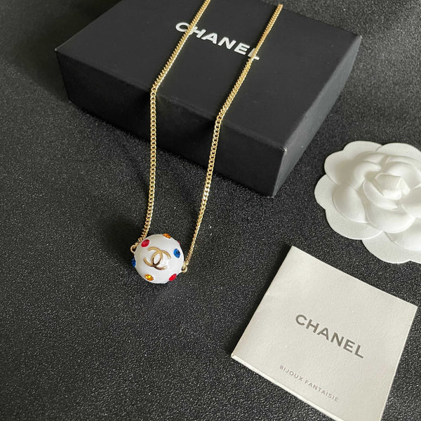 CC 26s Double C Logo White Enamel Crystal Ball Pendant Necklace In Gold Metal 629889