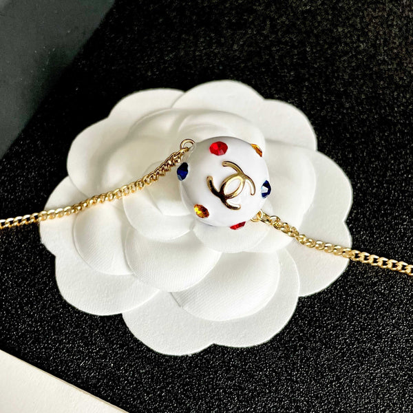 CC 26s Double C Logo White Enamel Crystal Ball Pendant Necklace In Gold Metal 629889