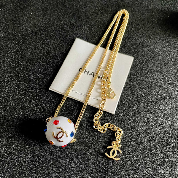 CC 26s Double C Logo White Enamel Crystal Ball Pendant Necklace In Gold Metal 629889