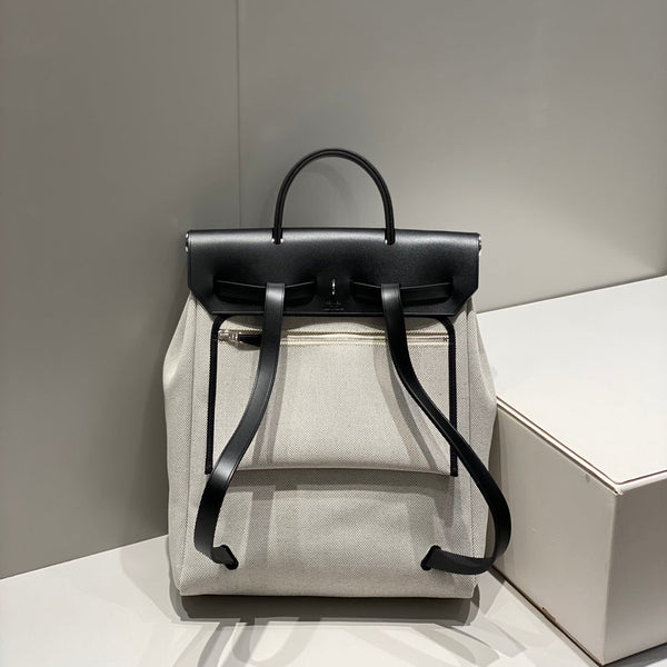HERBAG A DOS ZIP RETOURNE BACKPACK 29 IN OFF-WHITE CANVAS AND BLACK CALFSKIN