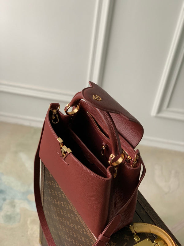 capucines mm 31.5 burgundy taurillon leather gold hardware