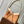 CARRYALL PM 29 IN CIDER BROWN MONOGRAM PERFORATED SUEDE AND WHITE SHEARLING TRIM