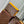 GASTON WEARABLE WALLET 18 IN BROWN MONOGRAM CANVAS MIX YELLOW CALFSKIN