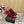 ORANGE GEM-STUDDED HIGH PUMPS IN RED PATENT CALFSKIN