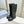KNEE BOOTS WITH TRIANGLE LOGO IN BLACK CALFSKIN
