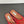 ALAIA FLAT MULES IN CHERRY RED MESH FISHNET