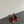 ORANGE GEM-STUDDED SLINGBACK PUMPS IN RED PATENT CALFSKIN