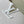 CAPUCINES EAST-WEST MINI 21 IN WHITE TAURILLON