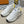 LV TRAINERS IN WHITE CALFSKIN AND JACQUARD