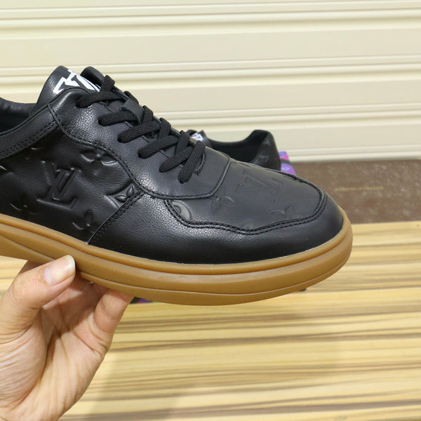 LV TRAINERS IN BLACK CALFSKIN AND BROWN RUBBER