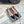 ALAIA FLAT SLINGBACK IN BLACK PATENT CALFSKIN AND FILM