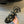 CLEMENCE MULTI TRIOMPHE 45 MM SANDAL IN BLACK LAMBSKIN