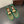 ALAIA BALLET FLATS IN COOL GREEN MESH FISHNET WITH GOLD HARDWARE