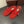 ALAIA BALLET FLATS IN CHERRY RED MESH FISHNET