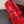 ALAIA BALLET FLATS IN CHERRY RED MESH FISHNET