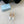 SLINGBACK PUMPS ATTACHED BOW IN WHITE GLOSSY CALFSKIN