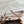 HERBAG ZIP 31 RETOURNE PEGASE POP BAG IN OFF-WHITE MIX RED CANVAS AND HUNTER COWHIDE