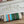 HERBAG ZIP 31 LAQUERED BAG IN GREEN MIX BLUE H PLUME CANVAS