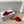 ALAIA FLAT MULE IN CHERRY RED SUEDE