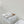 ALAIA VIENNE FLAT MULES IN WHITE LAMBSKIN